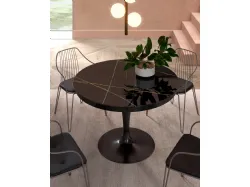 Tavolo rotondo allungabile Eclipse con top in marble glass Sahara Noir Lucido di Ozzio